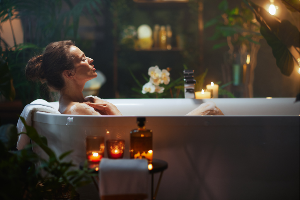 Mother soaking in a candlelit bath, practicing self-care as a way to recover from ND parent burnout.