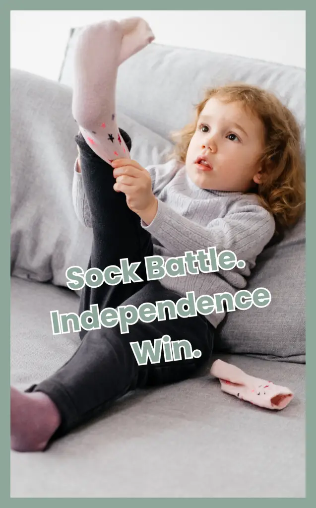 Young child putting on socks independently, symbolizing empowering independence in ND children.