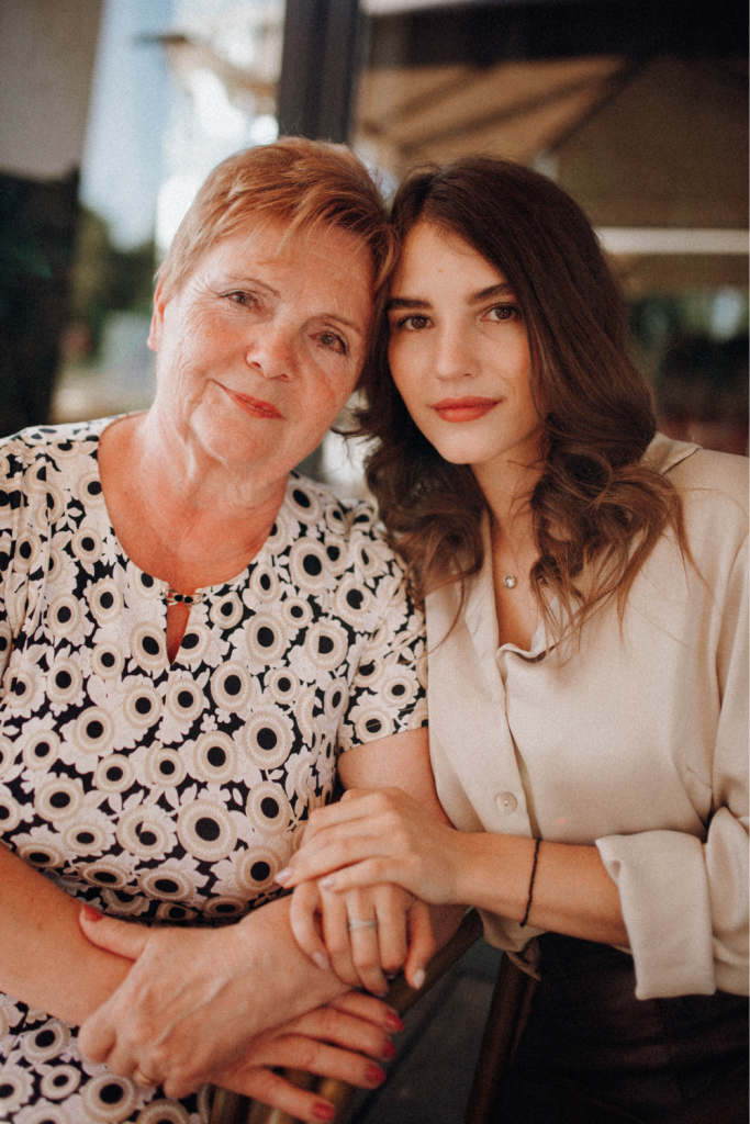 A mama stands arm-in-arm with a trusted support person, representing IEP meeting prep for ND mamas who bring emotional support to school advocacy meetings.