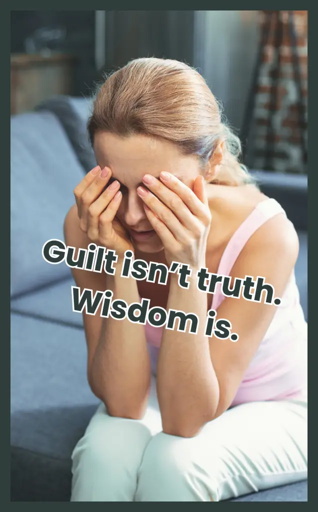 A mother sitting on a couch with her face in her hands, illustrating maternal guilt after a late or missed diagnosis.